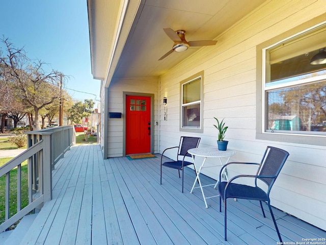 wooden terrace featuring ceiling fan