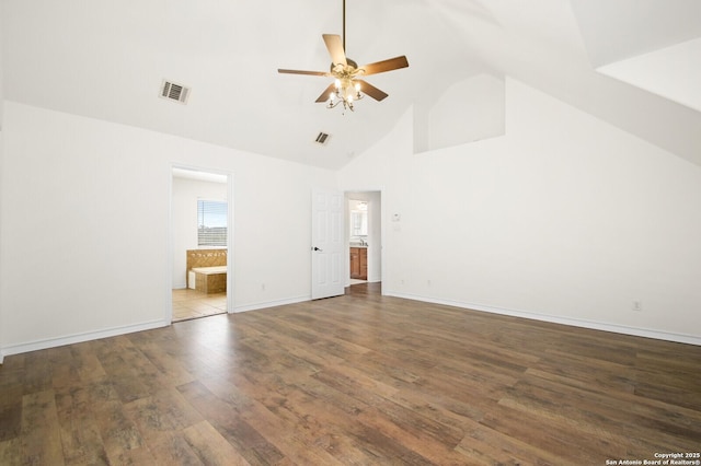 unfurnished bedroom with visible vents, high vaulted ceiling, ensuite bath, wood finished floors, and baseboards
