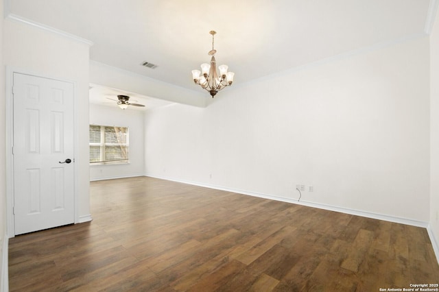 spare room with visible vents, dark wood-type flooring, ornamental molding, ceiling fan with notable chandelier, and baseboards