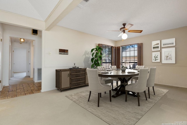 dining room with beam ceiling, visible vents, light colored carpet, and a ceiling fan