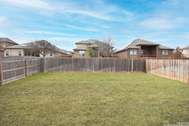 view of yard featuring a fenced backyard