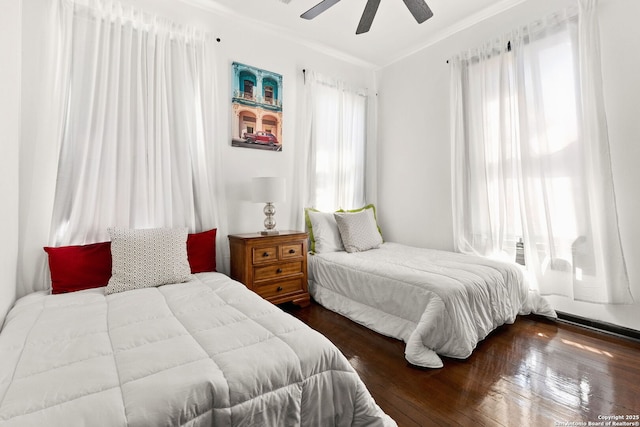 bedroom with a ceiling fan and wood finished floors