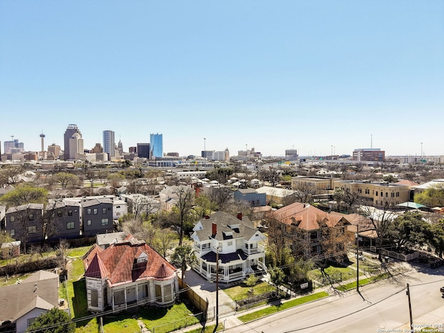 birds eye view of property with a city view