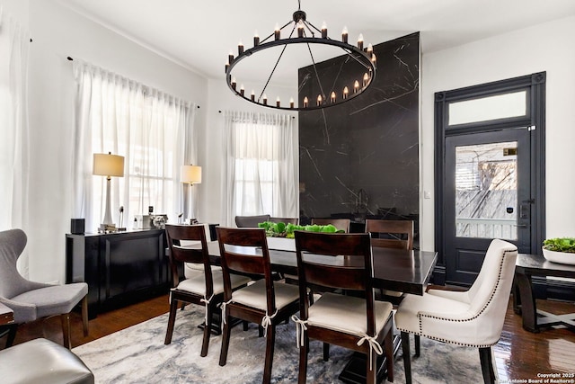 dining room featuring an inviting chandelier and wood finished floors