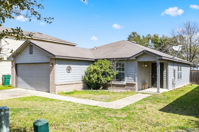 ranch-style house with a garage, brick siding, concrete driveway, and a front yard