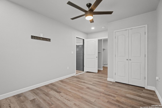 unfurnished bedroom featuring baseboards, a ceiling fan, and light wood finished floors