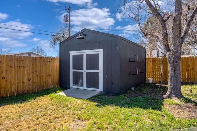 view of shed featuring a fenced backyard