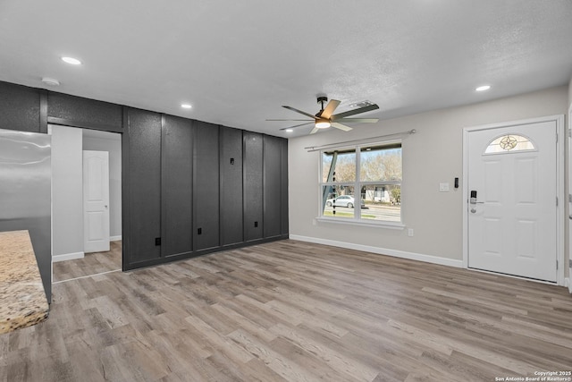 foyer with recessed lighting, baseboards, light wood-style floors, and ceiling fan