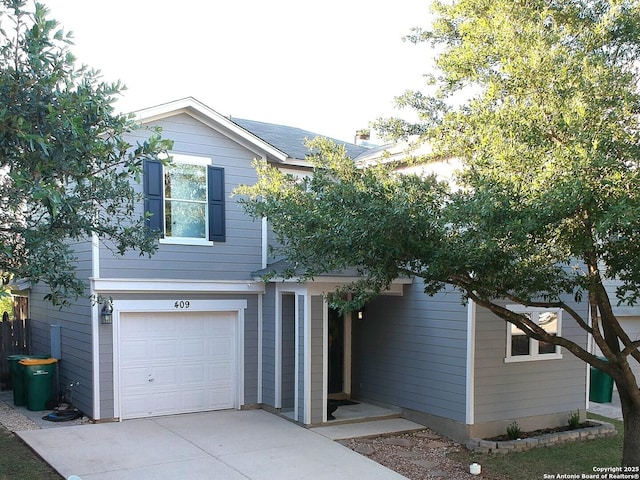 view of front of house featuring an attached garage and concrete driveway