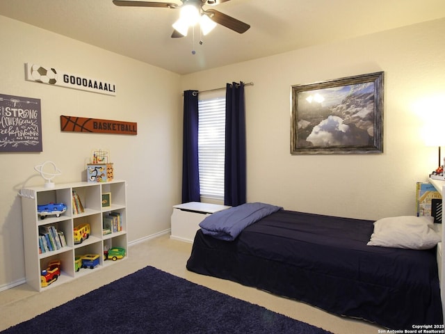 bedroom with carpet flooring, a ceiling fan, and baseboards