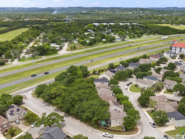 birds eye view of property with a residential view