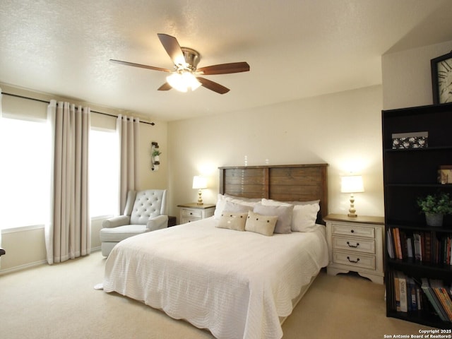 carpeted bedroom with a ceiling fan