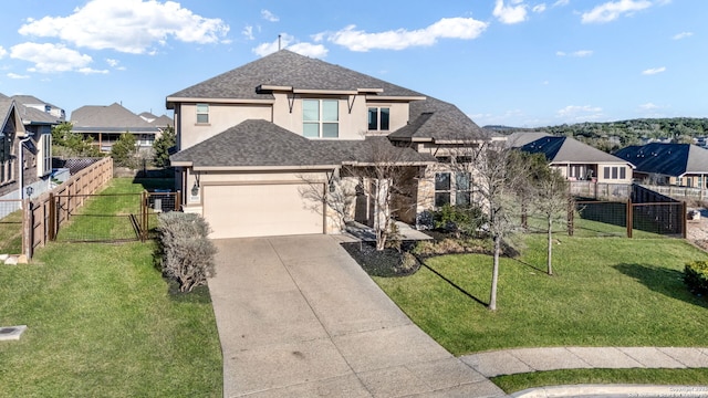 view of front facade featuring fence, driveway, roof with shingles, stucco siding, and a garage