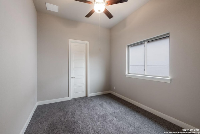 carpeted spare room featuring visible vents, ceiling fan, and baseboards