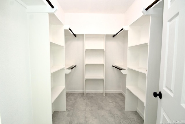 spacious closet featuring a barn door