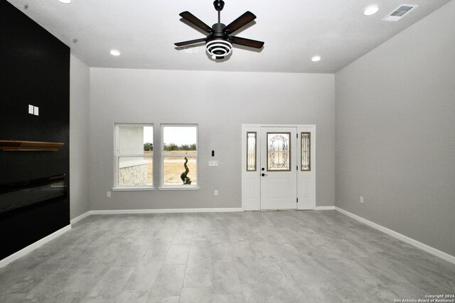 interior space featuring recessed lighting, baseboards, visible vents, and ceiling fan