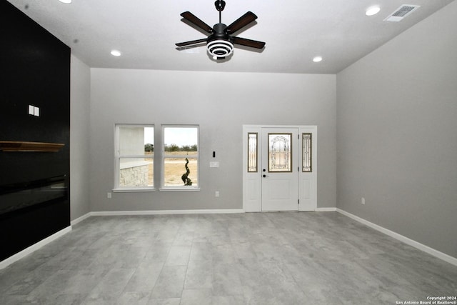 unfurnished living room featuring wood finished floors, baseboards, and visible vents