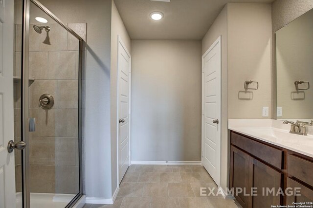 7015 Comanche Cave, San Antonio, TX 78247 - full bathroom with baseboards, a stall shower, and vanity