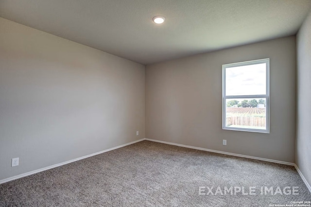 7015 Comanche Cave, San Antonio, TX 78247 - carpeted empty room with baseboards