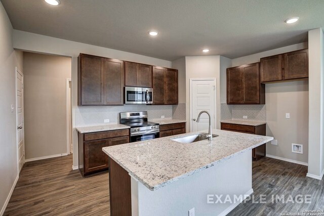 7015 Comanche Cave, San Antonio, TX 78247 - kitchen featuring a sink, appliances with stainless steel finishes, dark wood-style flooring, and dark brown cabinets