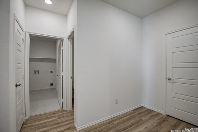 corridor featuring recessed lighting, baseboards, and light wood-type flooring