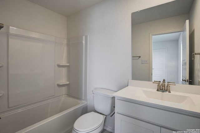 bathroom featuring toilet, vanity, and  shower combination