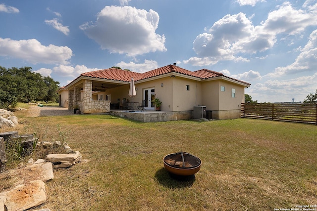 903 Panorama Pass, Horseshoe Bay, TX 78657 - rear view of house featuring a tiled roof, a yard, a patio area, fence, and french doors