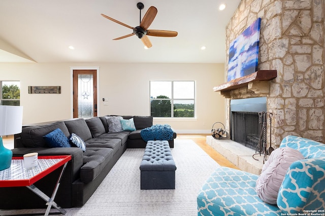 903 Panorama Pass, Horseshoe Bay, TX 78657 - living area with a stone fireplace, ceiling fan, recessed lighting, and wood finished floors