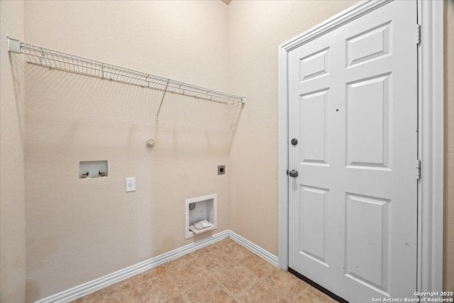 clothes washing area featuring baseboards, gas dryer hookup, washer hookup, laundry area, and electric dryer hookup