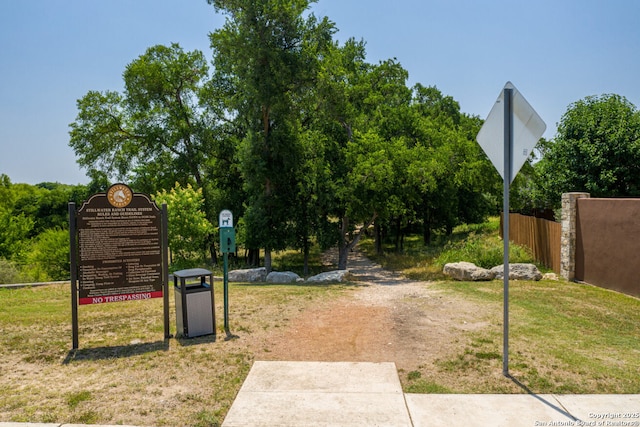 view of property's community featuring fence