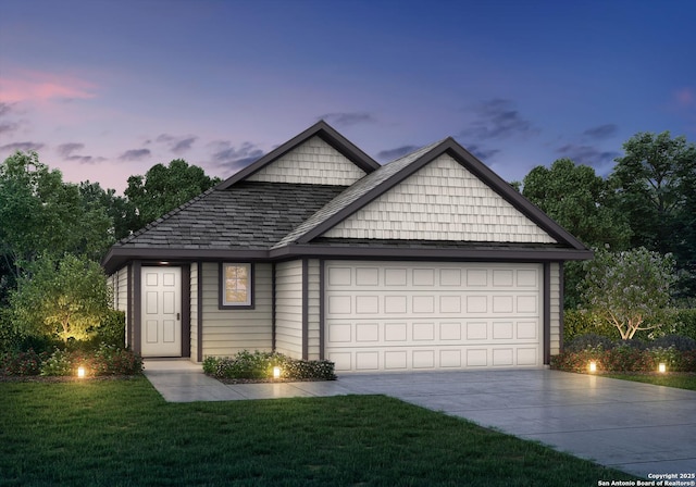 view of front facade featuring an attached garage, concrete driveway, a front yard, and roof with shingles