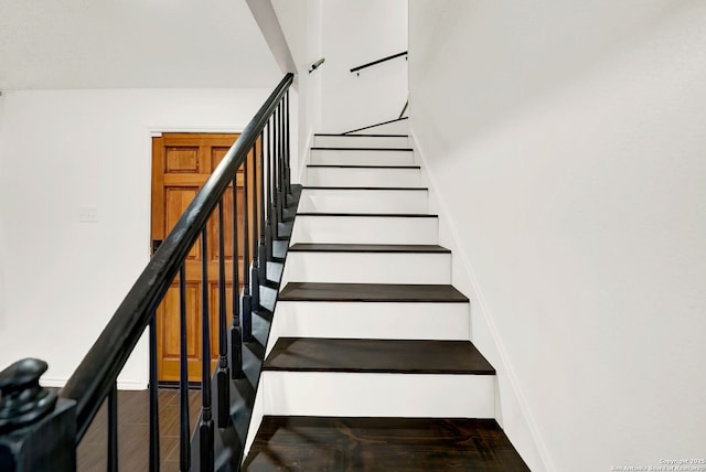 stairway featuring wood finished floors