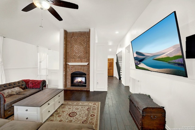 living room featuring a multi sided fireplace, recessed lighting, ceiling fan, and wood finished floors