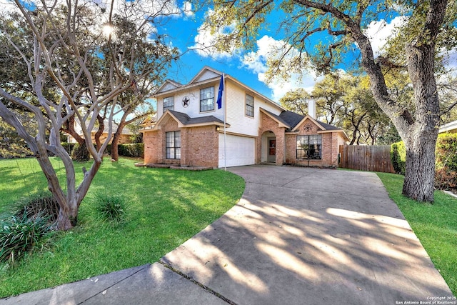 traditional-style house featuring brick siding, a front lawn, fence, concrete driveway, and an attached garage