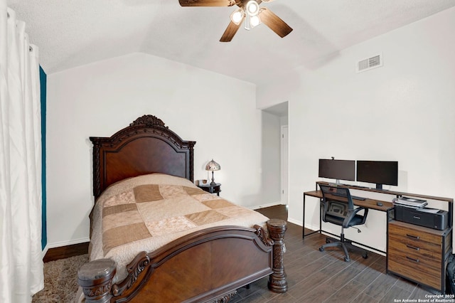 bedroom featuring visible vents, dark wood-style floors, baseboards, lofted ceiling, and ceiling fan