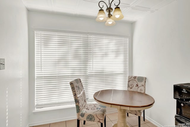 tiled dining room with baseboards, an ornate ceiling, and a notable chandelier