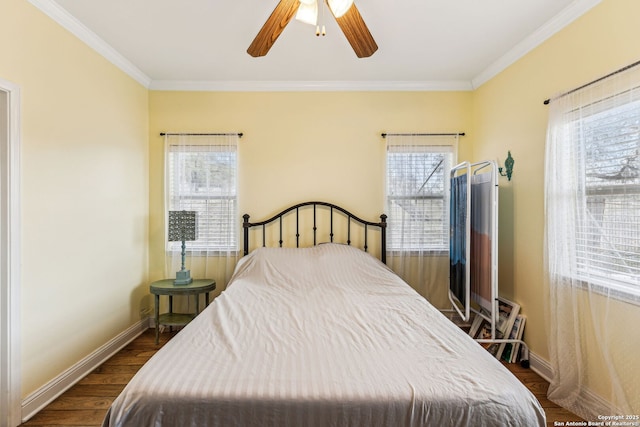 bedroom featuring a ceiling fan, crown molding, baseboards, and dark wood-style flooring