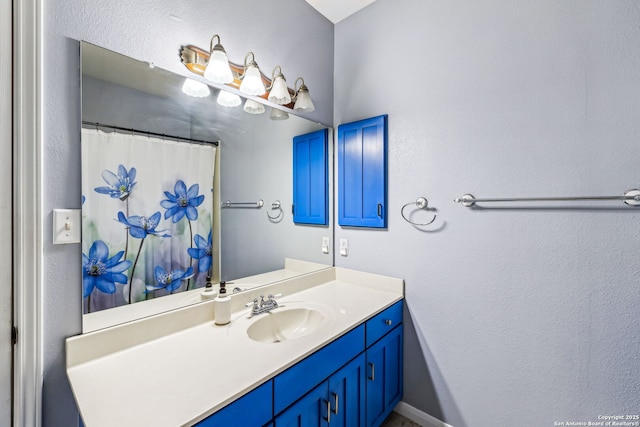 bathroom with vanity and a shower with shower curtain