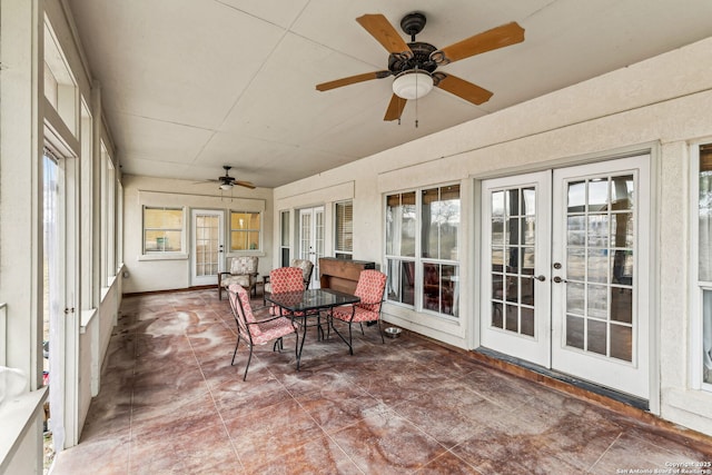 sunroom / solarium featuring french doors and a ceiling fan