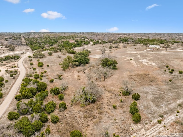 birds eye view of property featuring view of desert