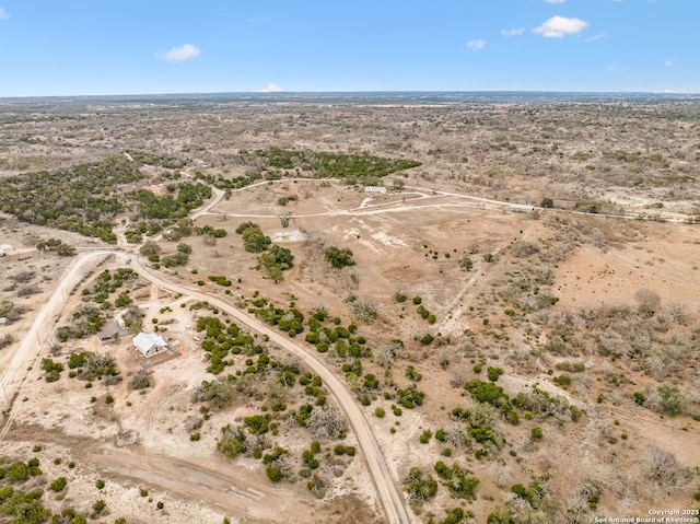 birds eye view of property featuring a rural view and view of desert