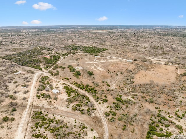 bird's eye view with a rural view and view of desert