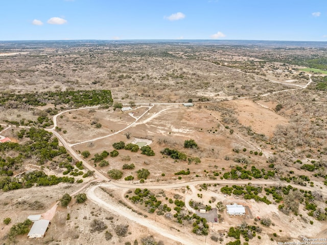 birds eye view of property featuring a rural view and view of desert