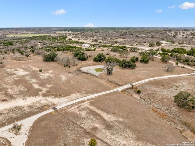 birds eye view of property with a rural view