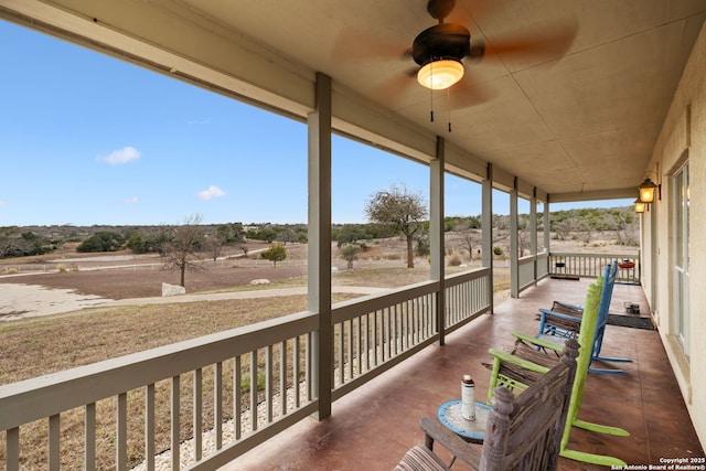 exterior space featuring a ceiling fan