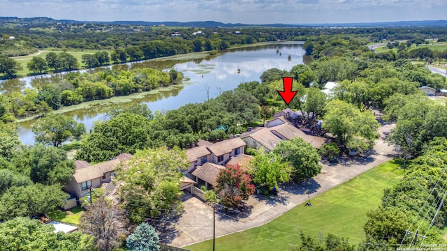 birds eye view of property with a water view