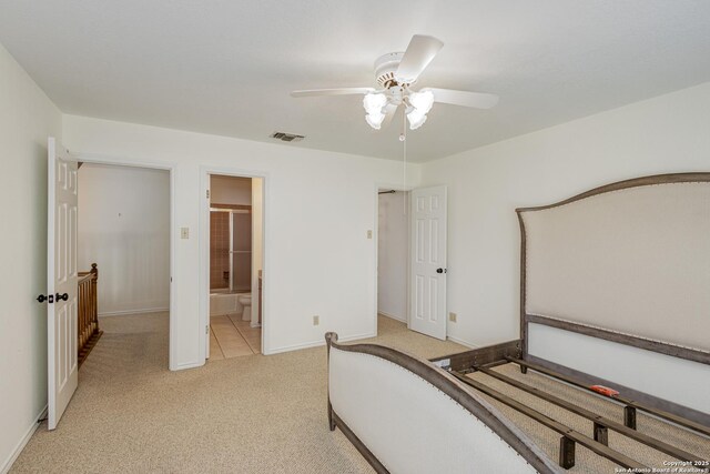 bedroom featuring light colored carpet, baseboards, visible vents, and ceiling fan
