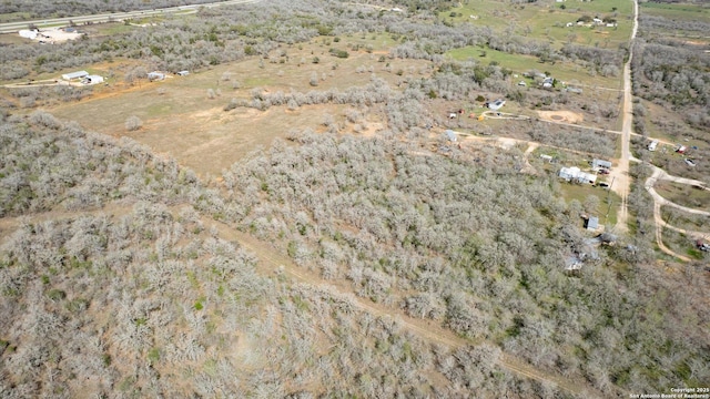 birds eye view of property with a rural view