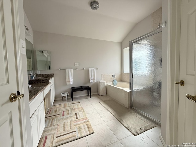 bathroom featuring vanity, lofted ceiling, tile patterned flooring, a shower stall, and a bath