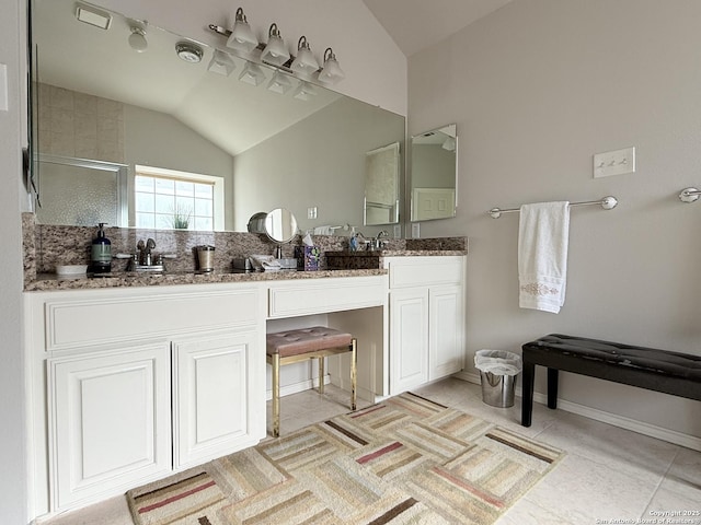 full bath featuring tile patterned floors, an enclosed shower, a sink, double vanity, and vaulted ceiling